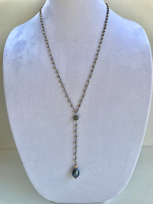 Pyrite beaded necklace with hematite focal bead and peacock pearl drop pendant