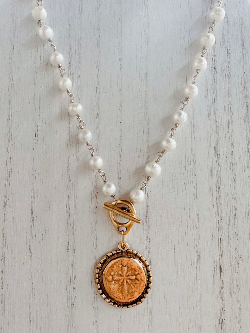 Pearl toggle with cross coin pendant