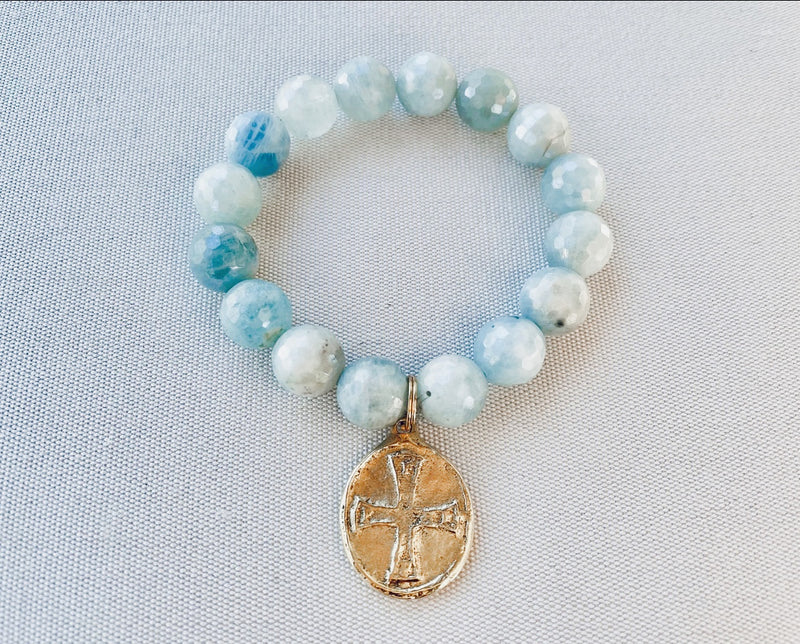 Aquamarine with cross charm bracelet