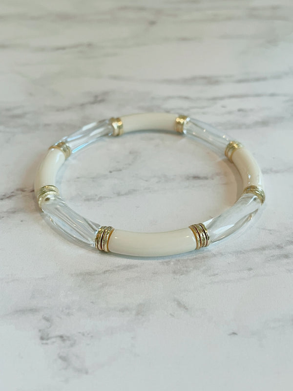 Small cylinder cream & clear lucite stretch bangle