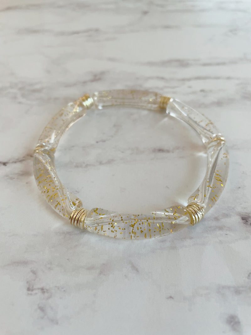 Clear with gold speckles lucite bracet