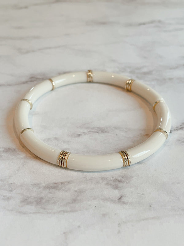 Small cylinder cream lucite stretch bangle