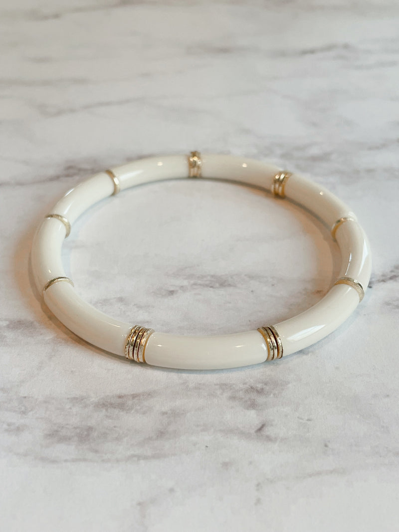 Small cylinder cream lucite stretch bangle